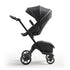Stokke Luxury Baby Stroller - Adjustable for Both Baby & Parents’ Comfort - Padding, Harness & Reflective Zipper for Added Safety - Folds in One Step - Black